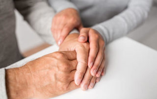 Seniors holding hands