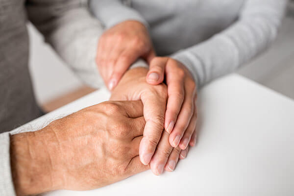Seniors holding hands