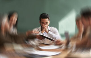 Stress, migraine and motion blur with a business man in a meeting feeling frustrated, tired or overworked. Mental health, anxiety and headache with an exhausted male employee suffering from fatigue